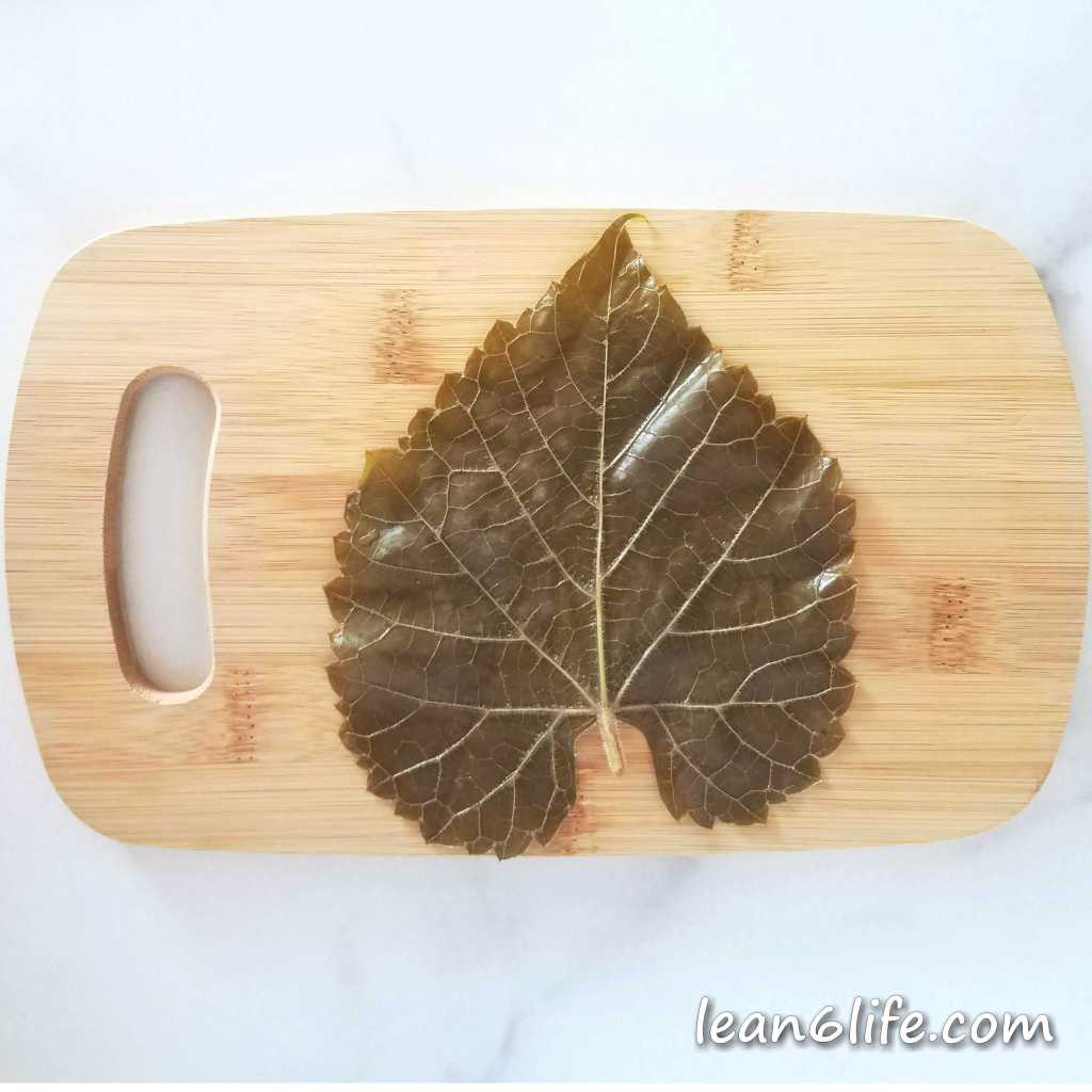 Blanched grape leaf laid out