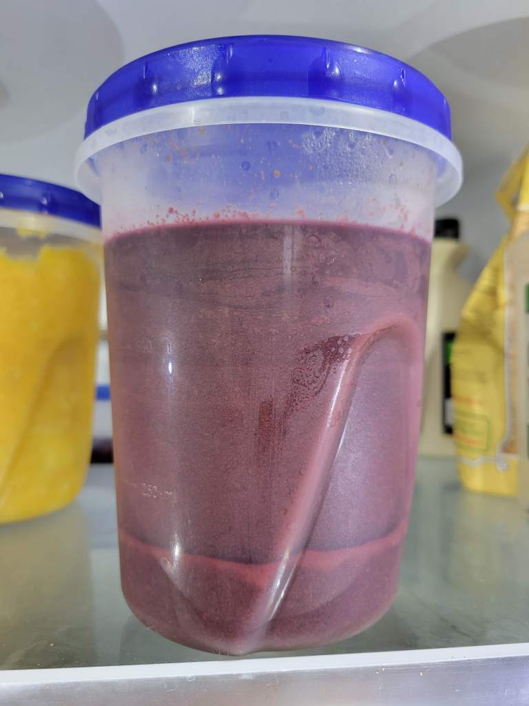 Allowing the tartaric acid to settle out of the grape juice