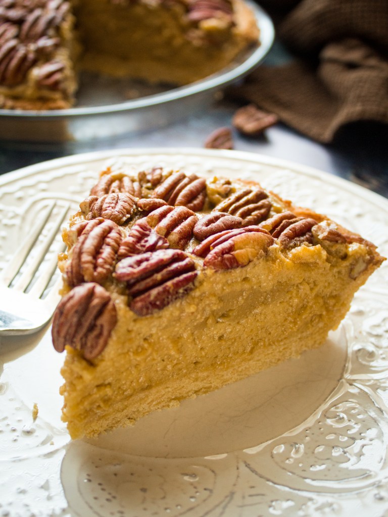 A slice of pawpaw pecan pie on a plate